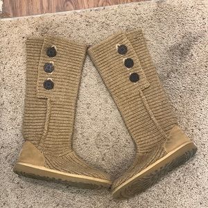 Tan ugg boots with dark brown buttons at top